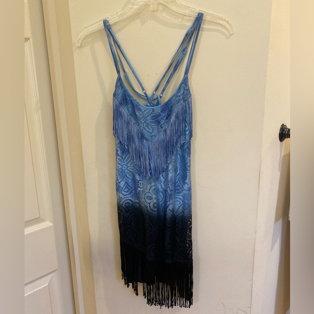 Woman’s tank top with spaghetti, straps, lace, crochet, and lots of tassels